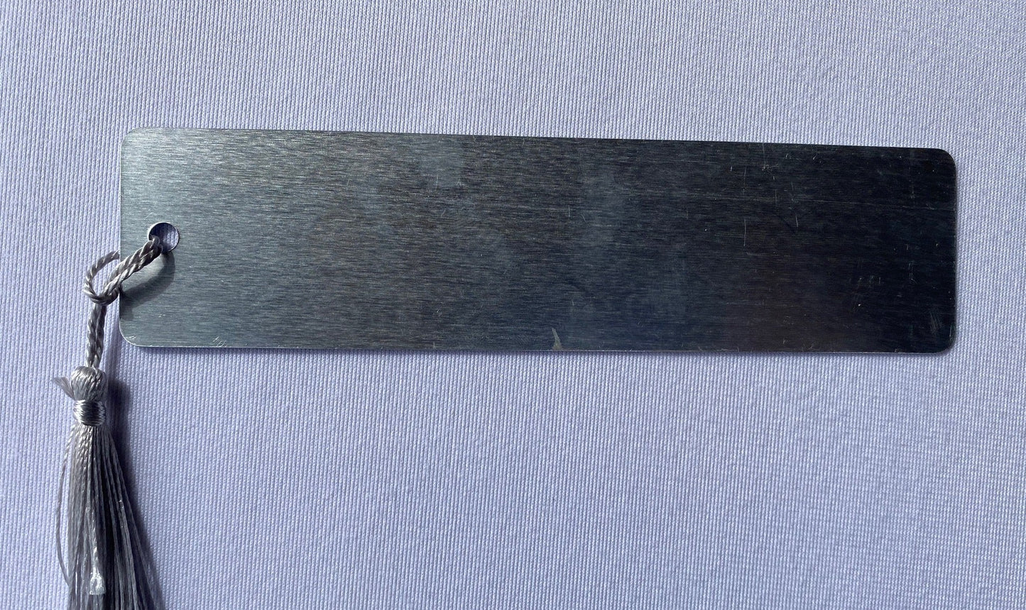 Bookmark-metal photograph of Courthouse rock at night with Confucius quote