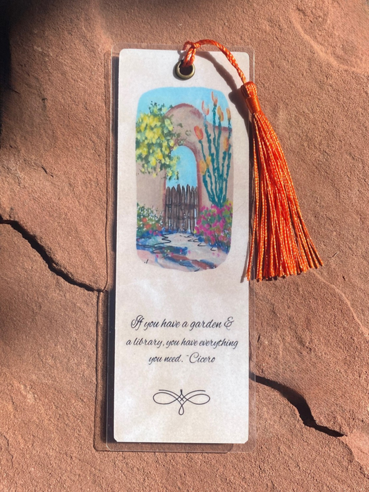 Bookmark with garden illustration and tassel on a textured surface