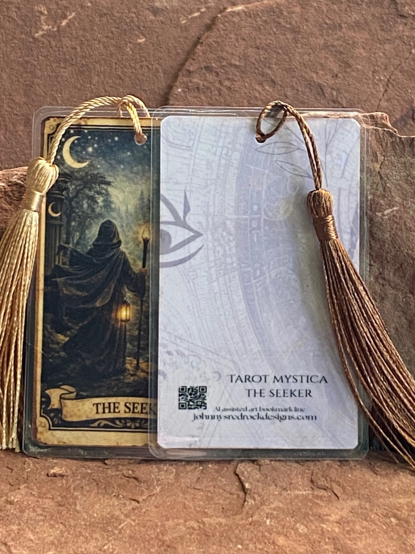 Tarot card design with tassels on a textured surface