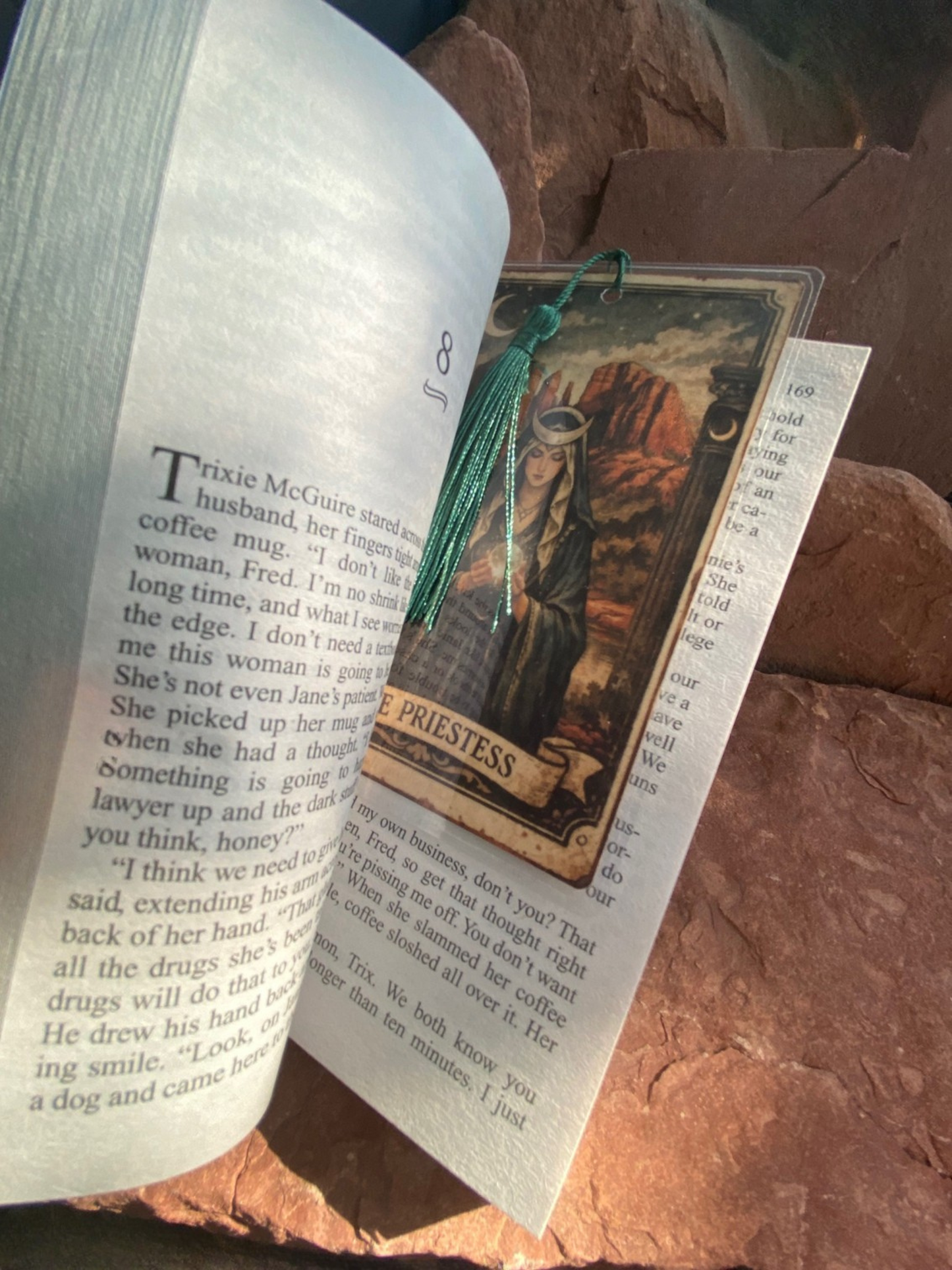 Extra large bookmark shown in standard paperback for scale reference only
