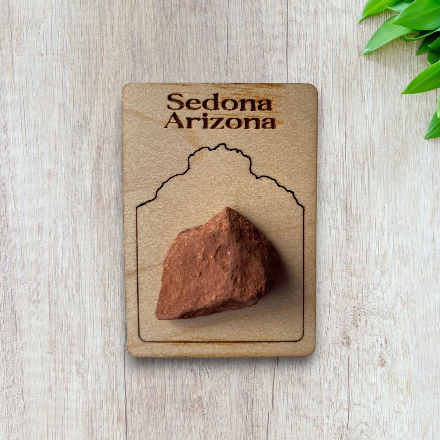 A piece of Sedona Rock Magnet with Bell Rock outline