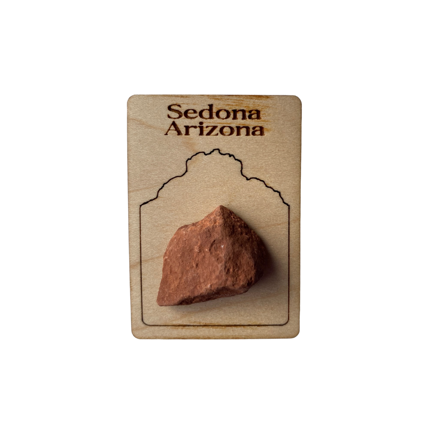 A piece of Sedona Rock Magnet with Bell Rock outline