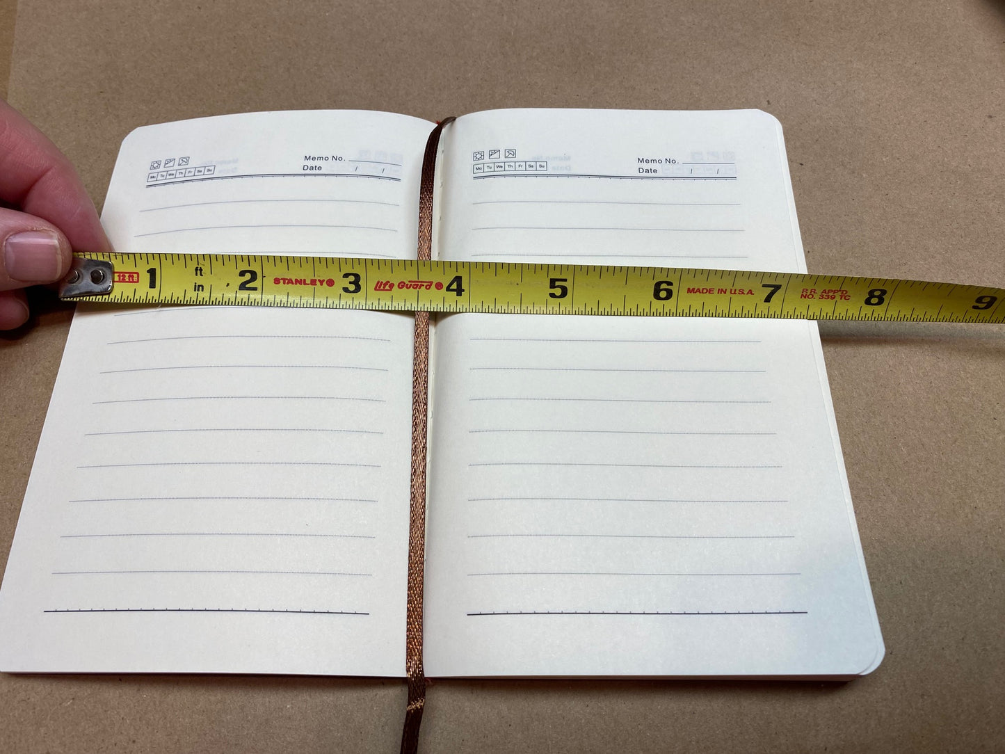 Journal pages fully open approximately 7.25 inches