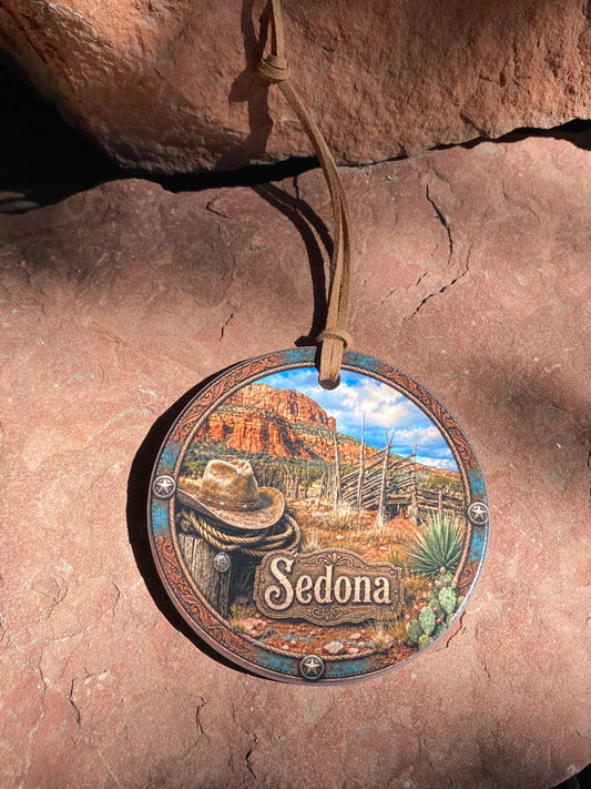 Ceramic ornament featuring old corral western hat