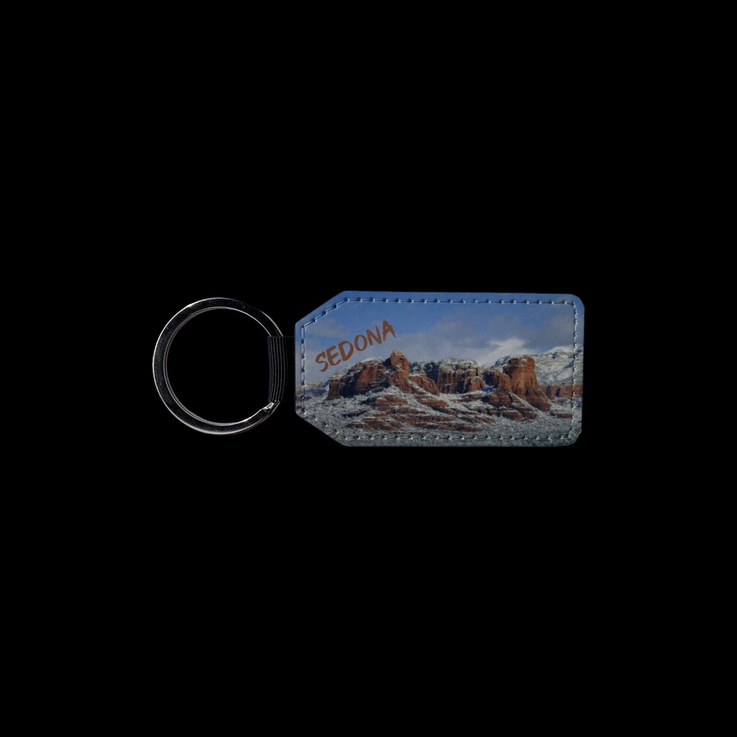 Keychain with Sweeping views of Sedonas Majestic Red Rocks covered in snow