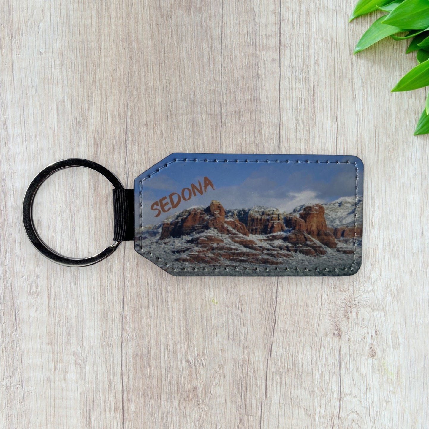 Keychain with Sweeping views of Sedonas Majestic Red Rocks covered in snow